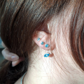 Stud earrings silver blue topaz 8x4 nav / 4 mm round fac